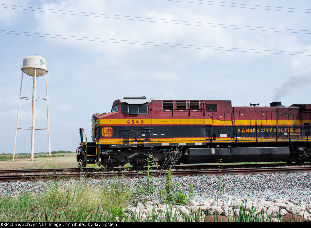 KCSM 4549 poses with a water tower